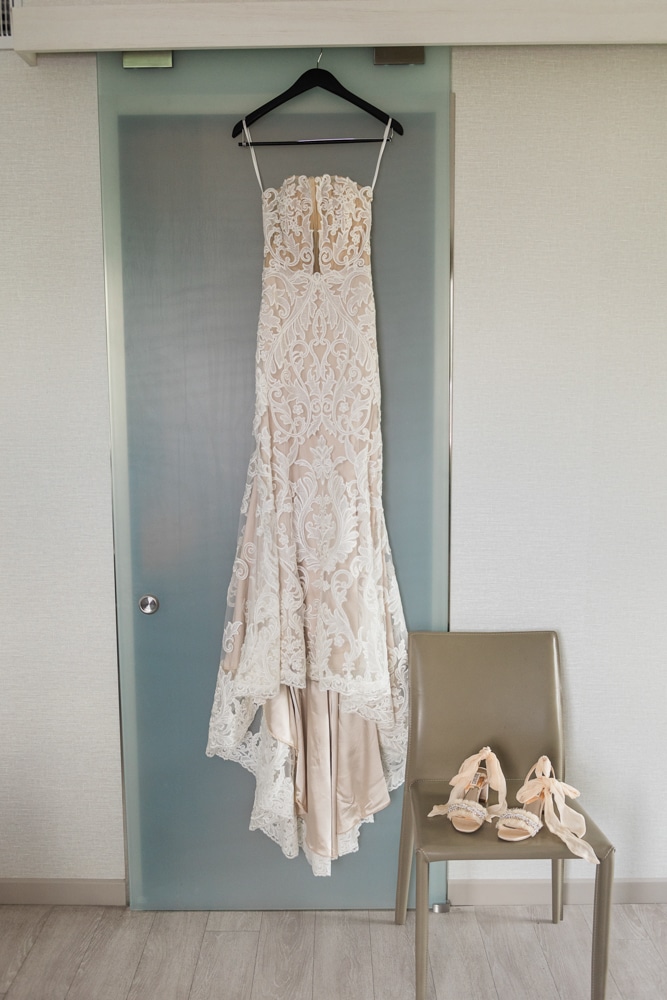 Wedding Dress hanging in hotel room