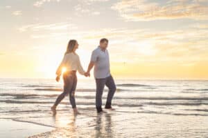Sand Key Park Engagement Session at sunset with a couple walking