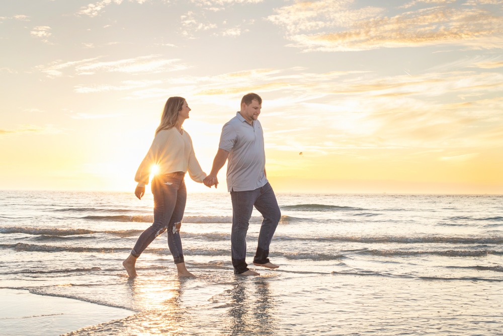 Sand Key Park Engagement Session at sunset with a couple walking